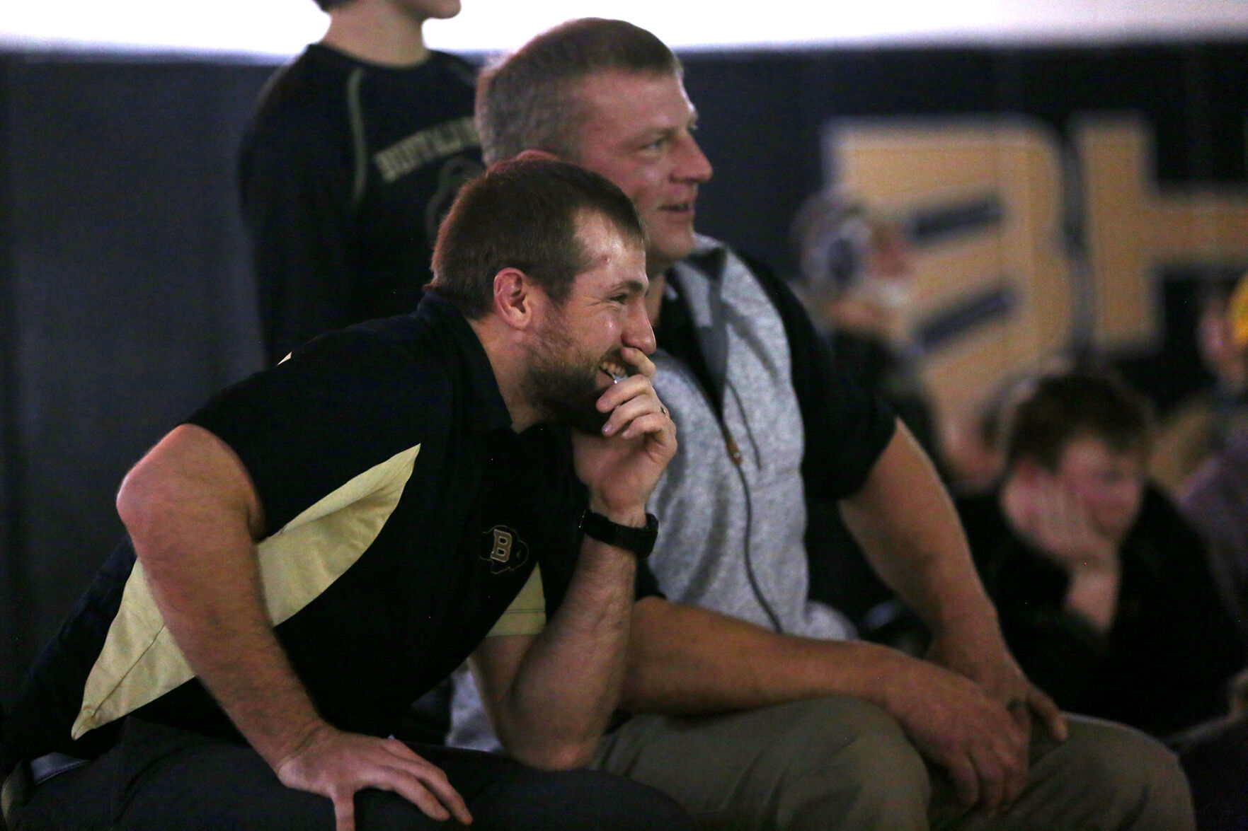 Garrett Traylor and assistant coach Jason Tomich laugh